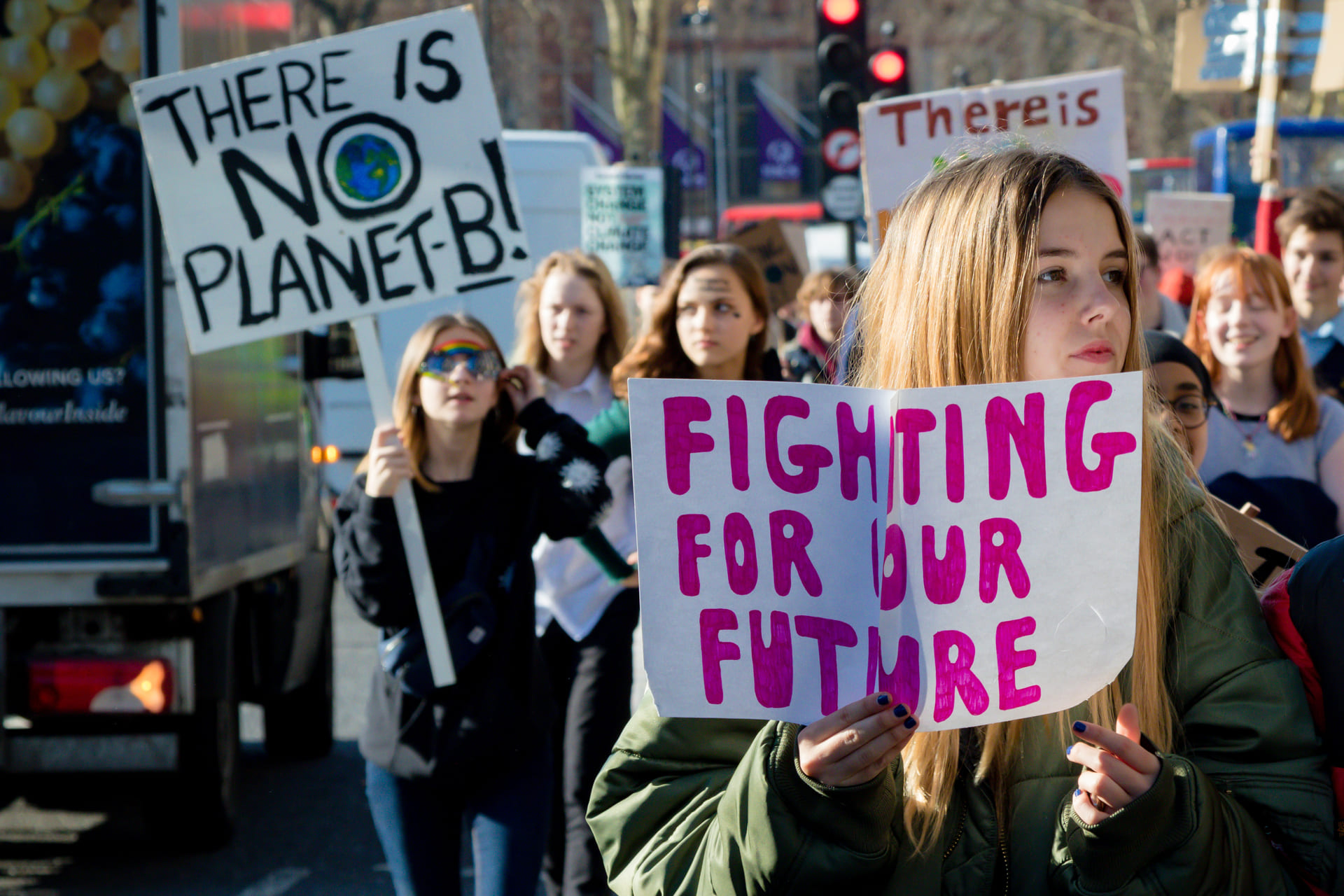 Striking school aged children in central London over climate change holding placards