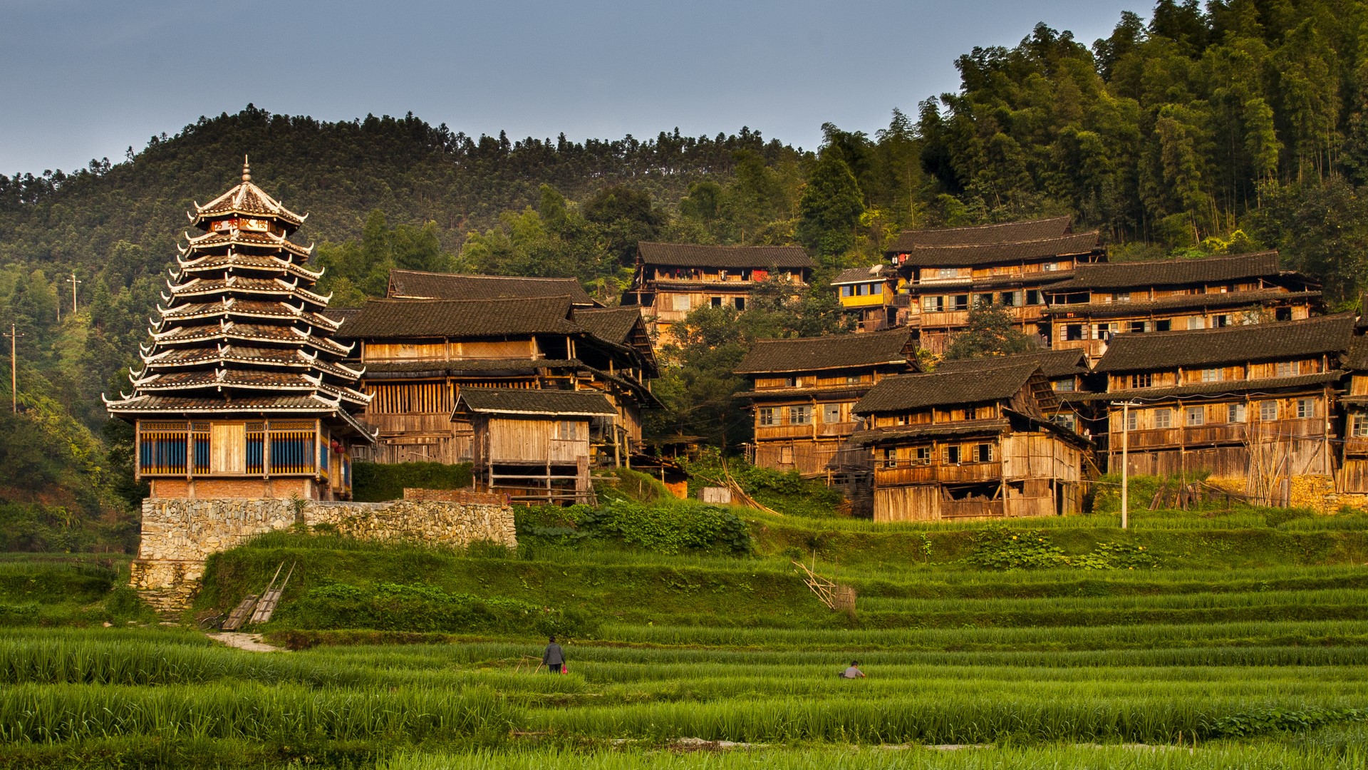 Sunrise on the western section of Gaoxiu Village with women s drum tower