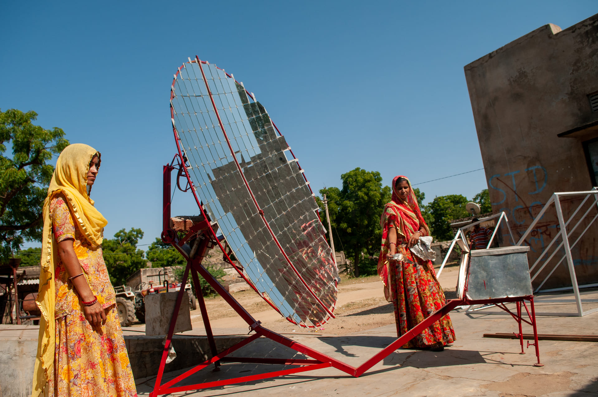 Women constructing solar cookers